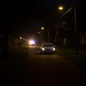 Police car in a Shreveport neighborhood at night