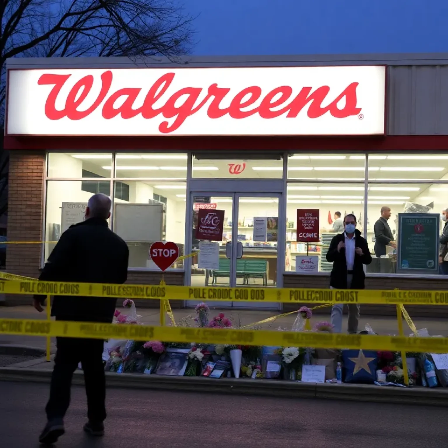 Memorial outside Walgreens store in Shreveport following robbery incident.