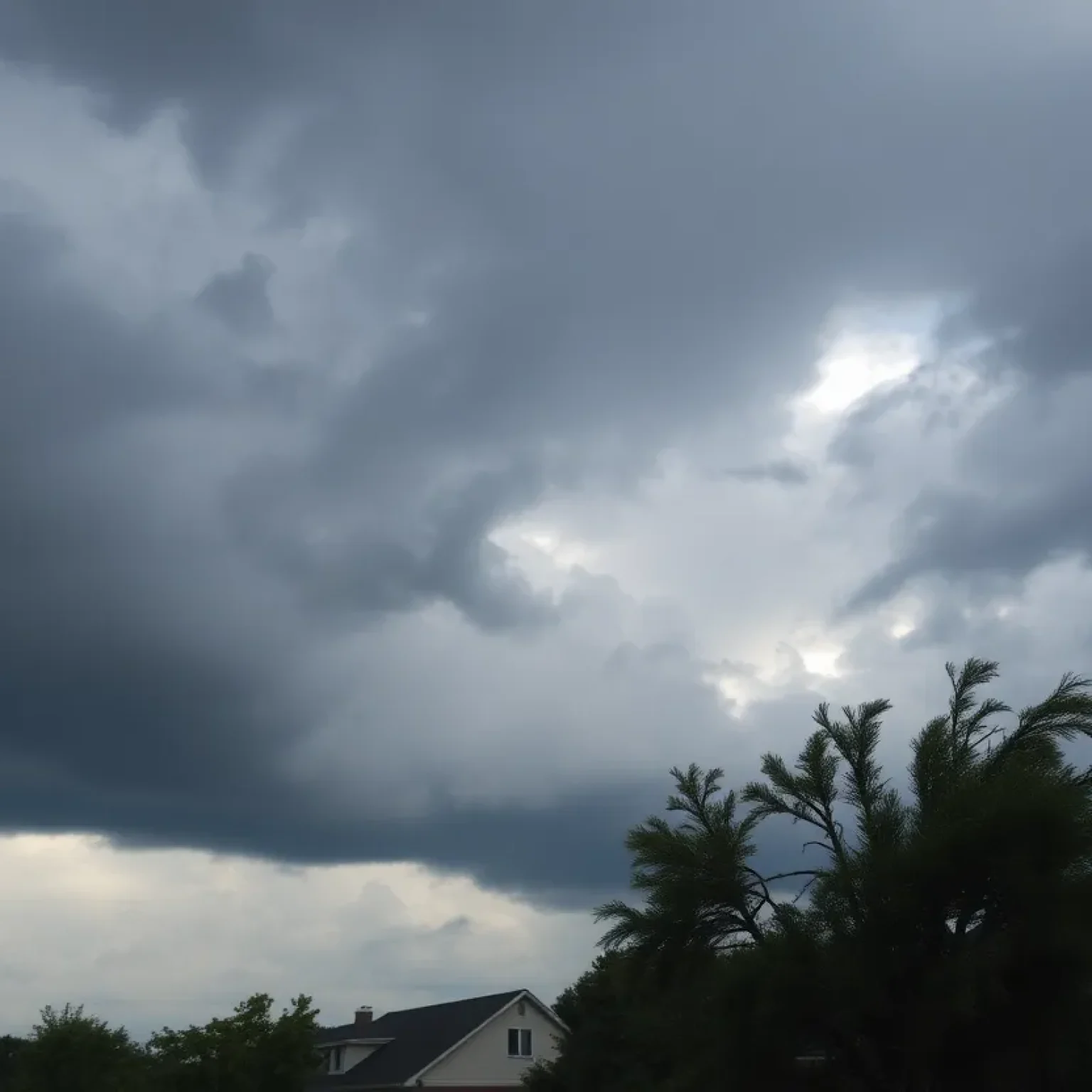 Storm clouds and damaged homes in Shreveport, Louisiana